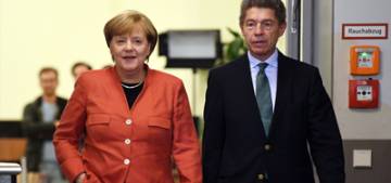 Almanya secimlerini Merkel kazandi